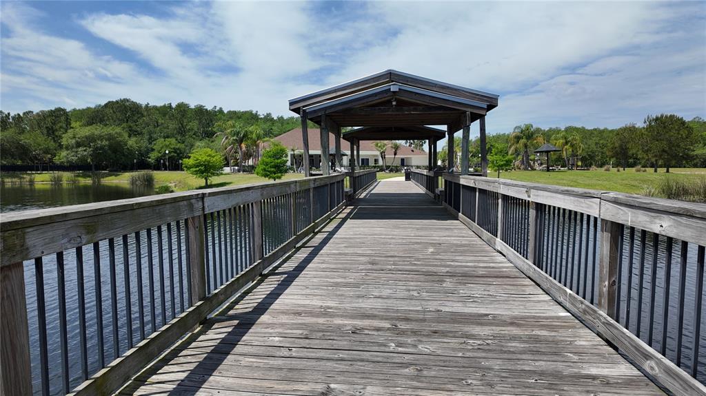 2543 Old Kent Circle Kissimmee, FL 34758 - Photo 36 of 41 a wooden bench sitting next to a yard