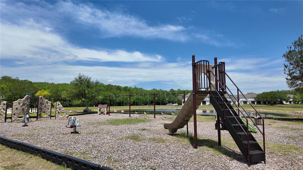 2543 Old Kent Circle Kissimmee, FL 34758 - Photo 38 of 41 a view of a park with swings