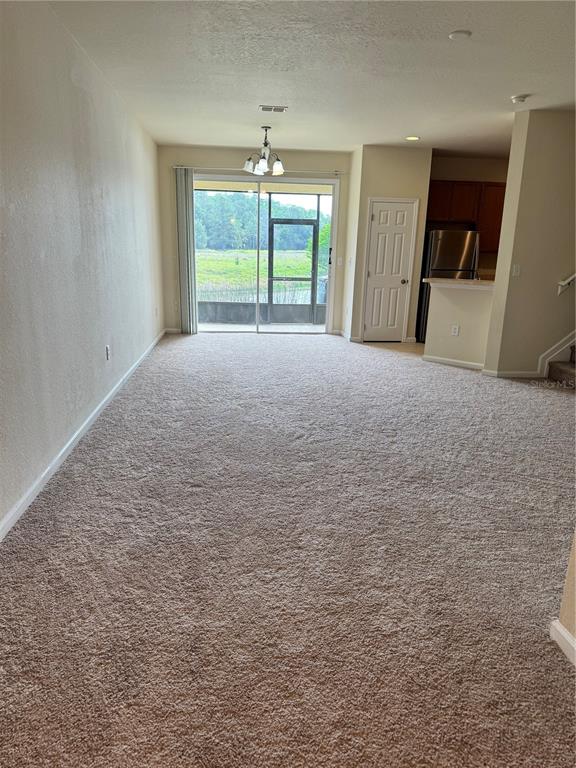 2543 Old Kent Circle Kissimmee, FL 34758 - Photo 4 of 41 a view of an empty room with a window