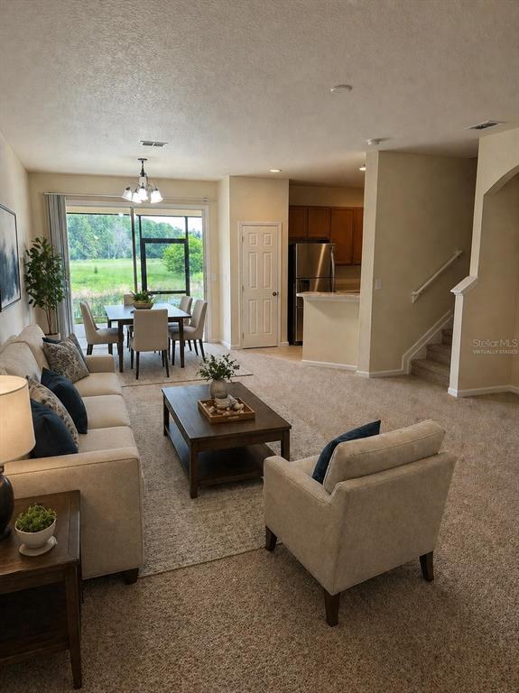 2543 Old Kent Circle Kissimmee, FL 34758 - Photo 5 of 41 a living room with furniture and a large window