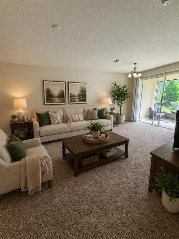 2543 Old Kent Circle Kissimmee, FL 34758 - Photo 7 of 41 a living room with furniture and a large window