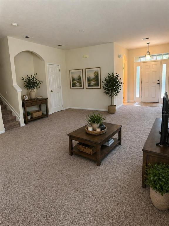 2543 Old Kent Circle Kissimmee, FL 34758 - Photo 9 of 41 a living room with furniture and a flat screen tv