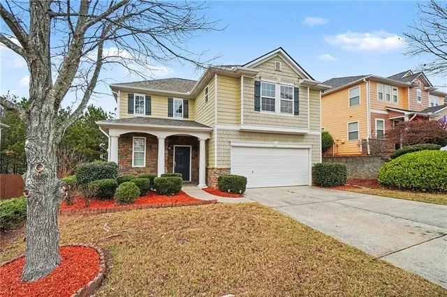 a front view of a house with yard