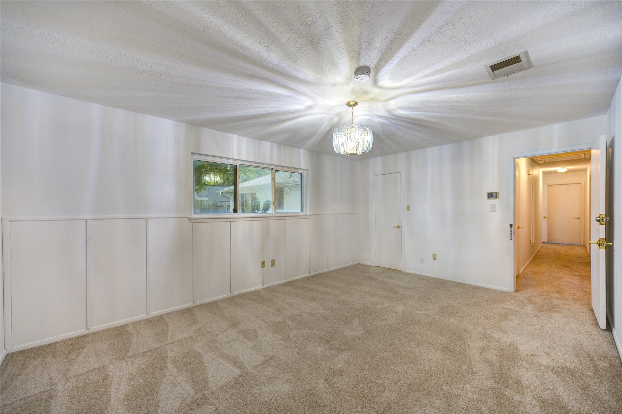 10823 Radford Lane Houston, TX 77031 - Photo 14 of 18 an empty room with windows and fan
