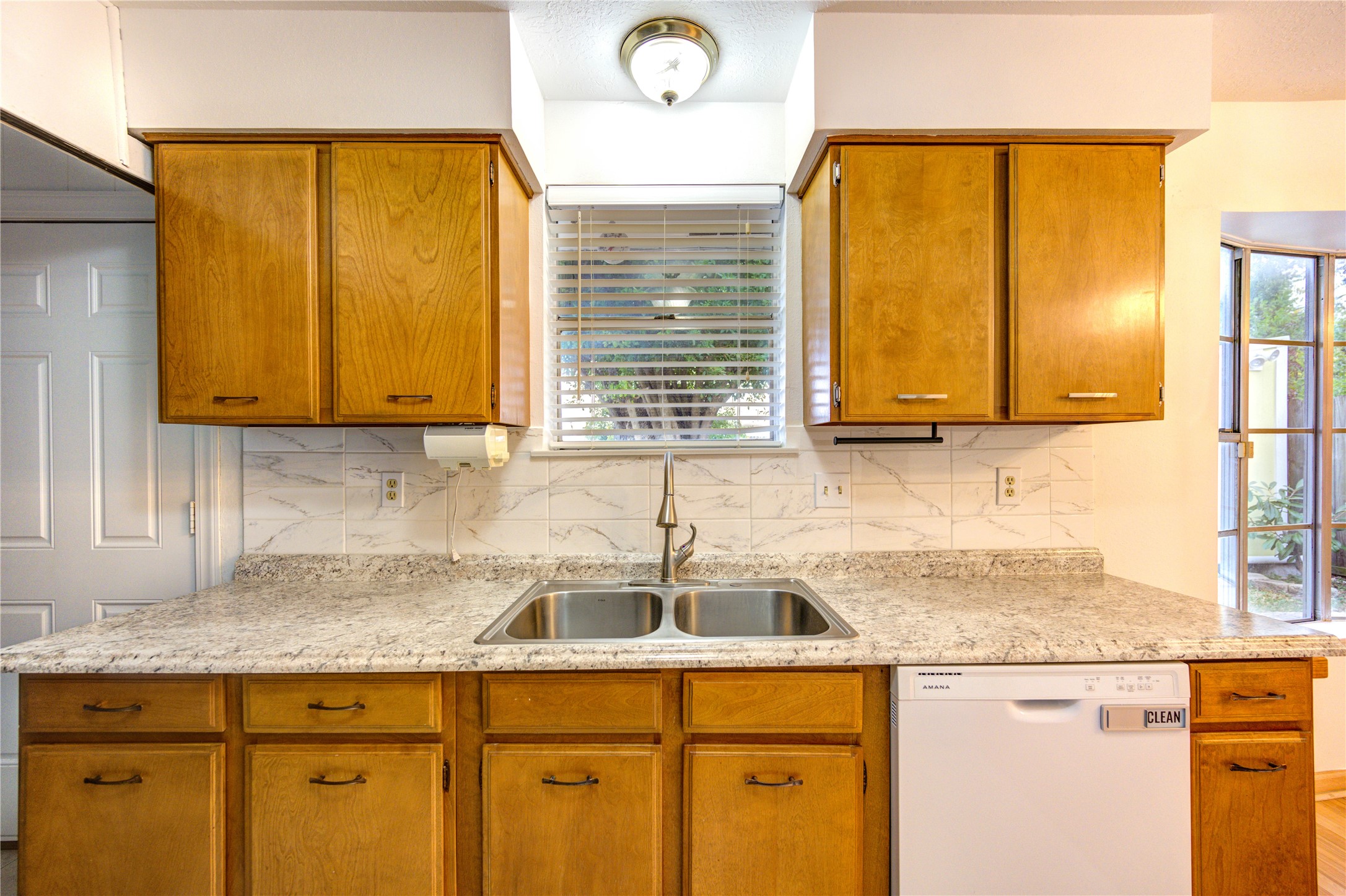 10823 Radford Lane Houston, TX 77031 - Photo 8 of 18 a kitchen with stainless steel appliances granite countertop a sink and a window