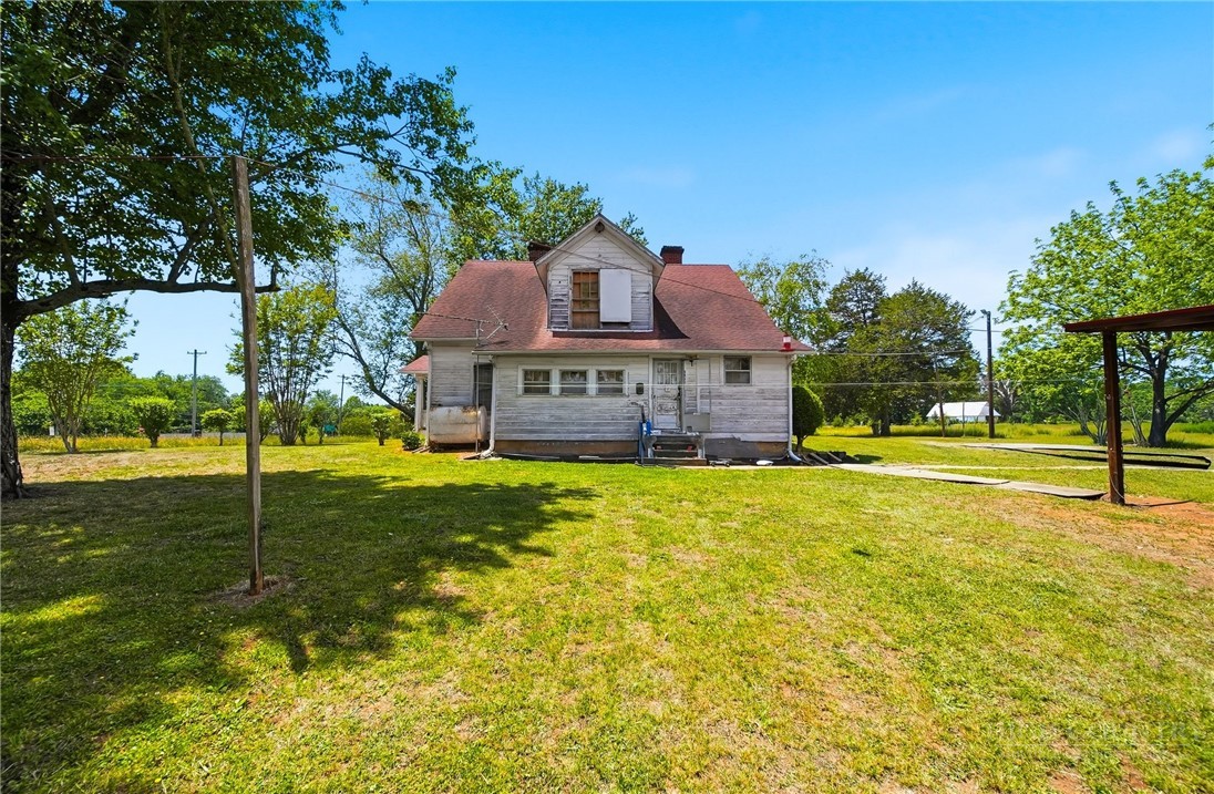3450 Sparta Road North Wilkesboro, NC 28659 - Photo 21 of 34 a front view of a house with a yard