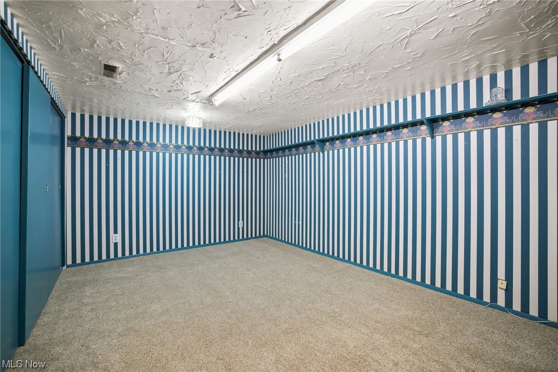 730 East Nimisila Road Uniontown, OH 44685 - Photo 22 of 25 View of carpeted empty room