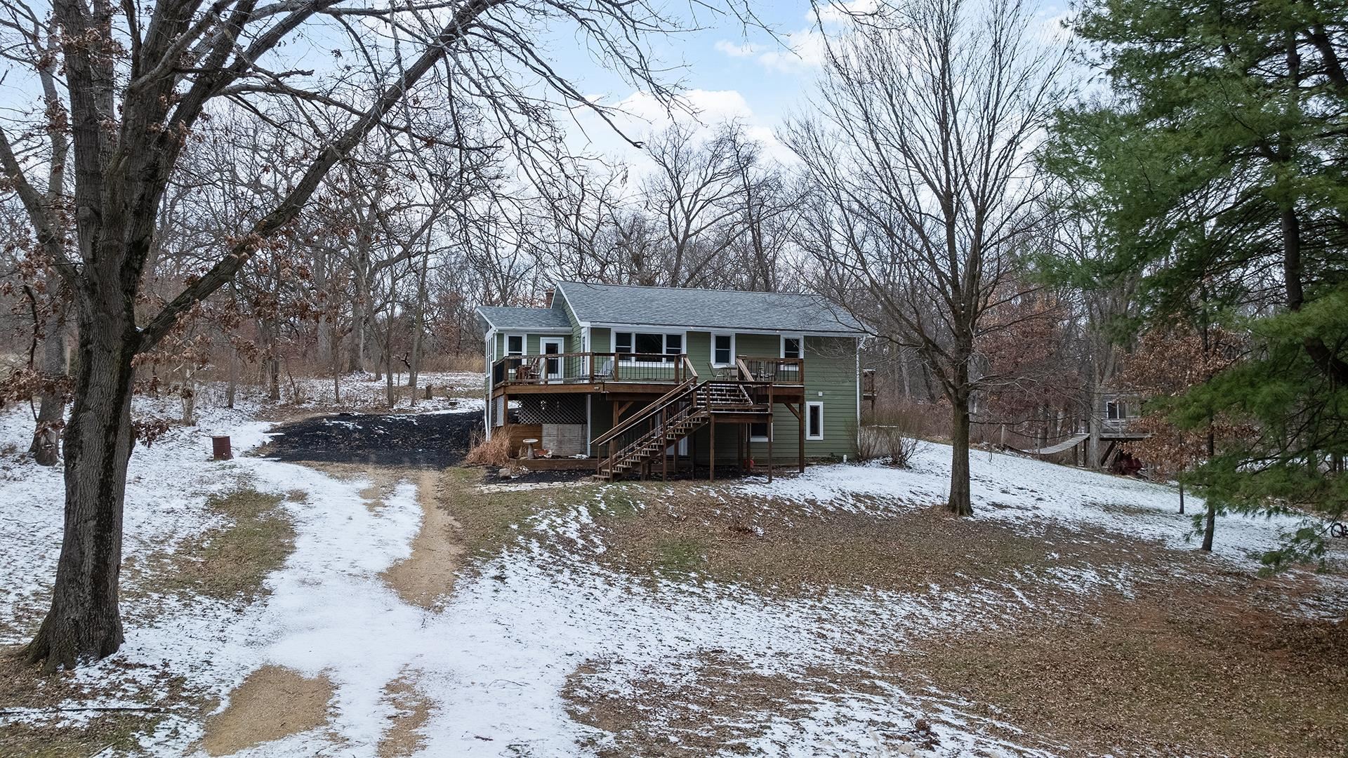 2063 Grand Detour Road Dixon, IL 61021 - Photo 1 of 44 a view of a house with a yard covered in snow
