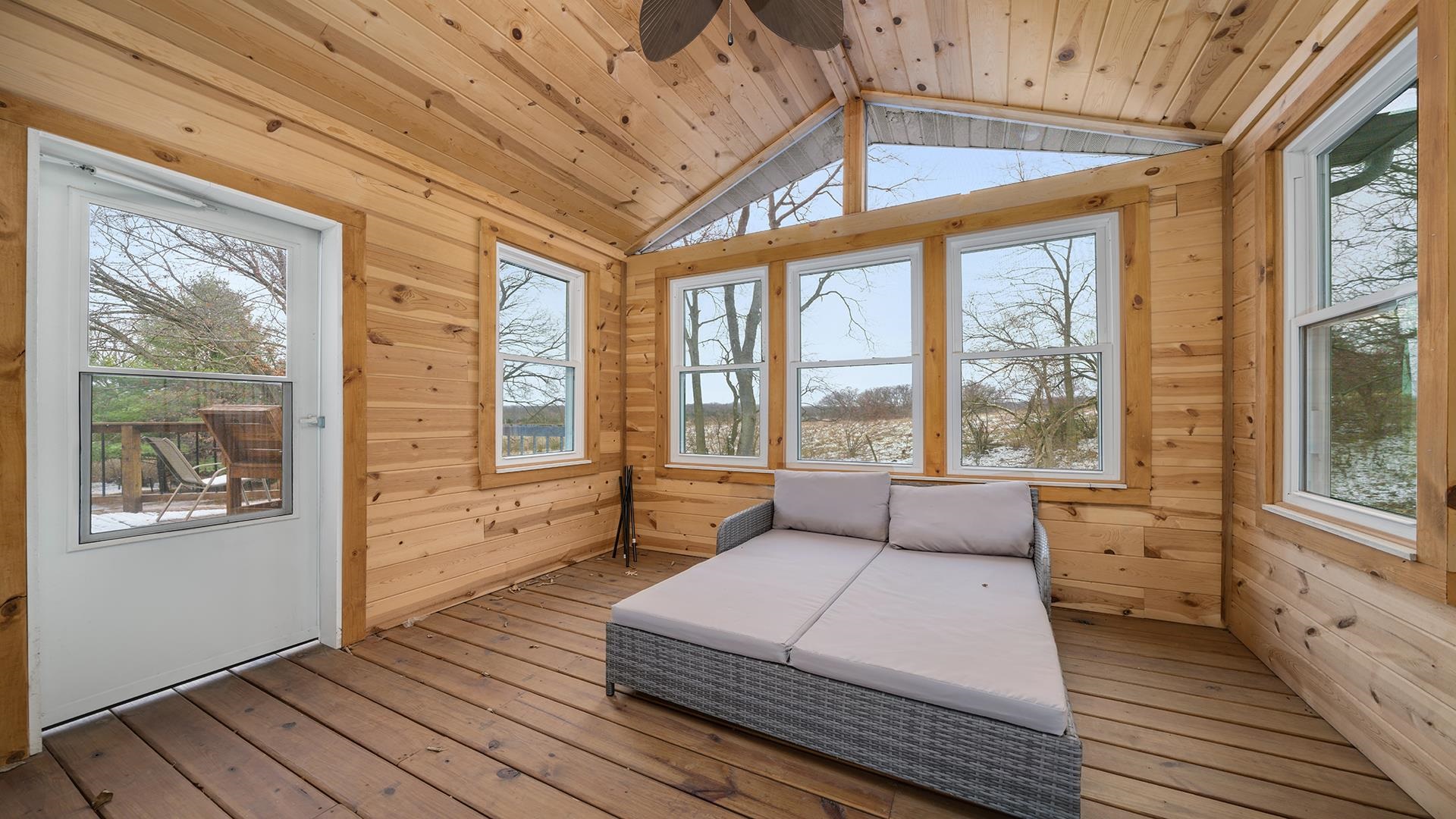 2063 Grand Detour Road Dixon, IL 61021 - Photo 12 of 44 a spacious bedroom with a large bed and a large window
