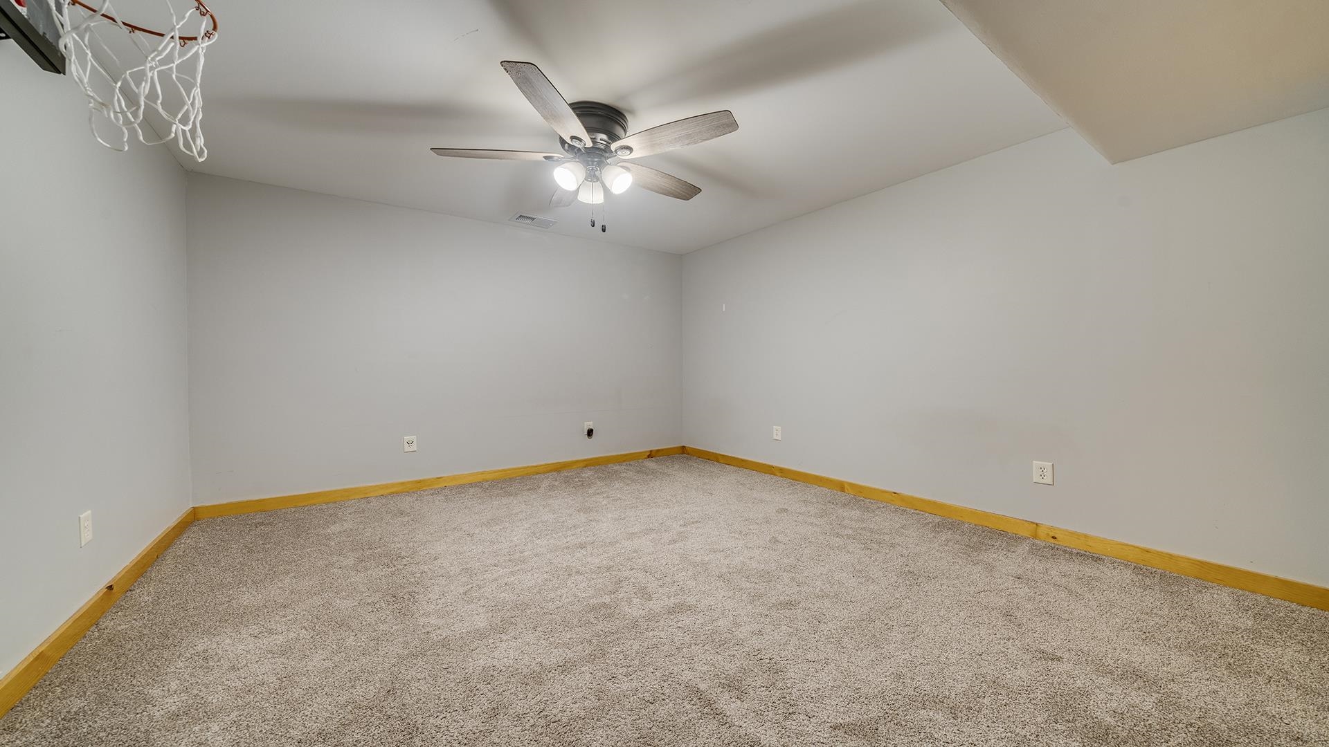 2063 Grand Detour Road Dixon, IL 61021 - Photo 28 of 44 an empty room with a chandelier fan and windows