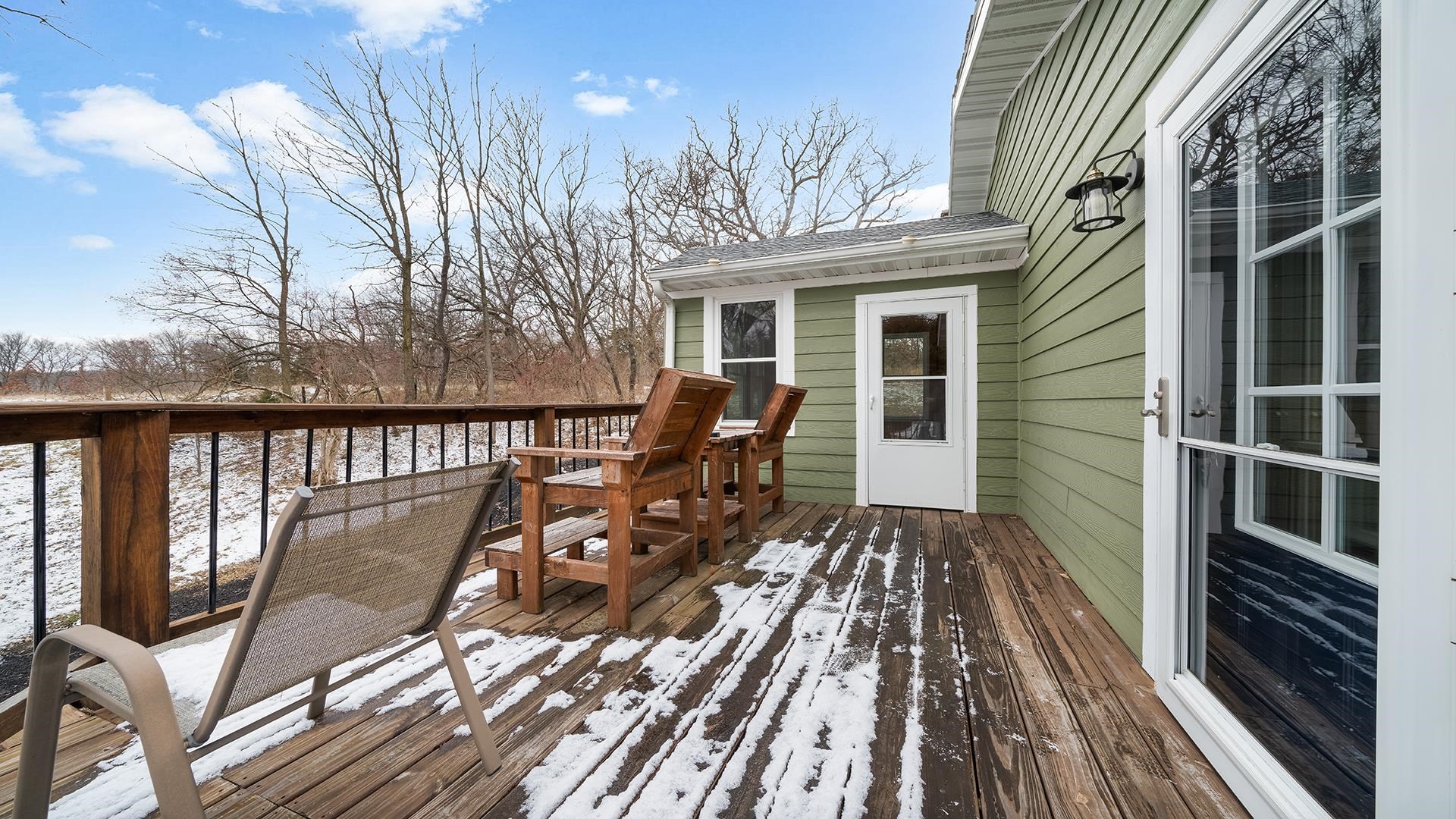 2063 Grand Detour Road Dixon, IL 61021 - Photo 30 of 44 a view of a balcony with wooden floor and fence