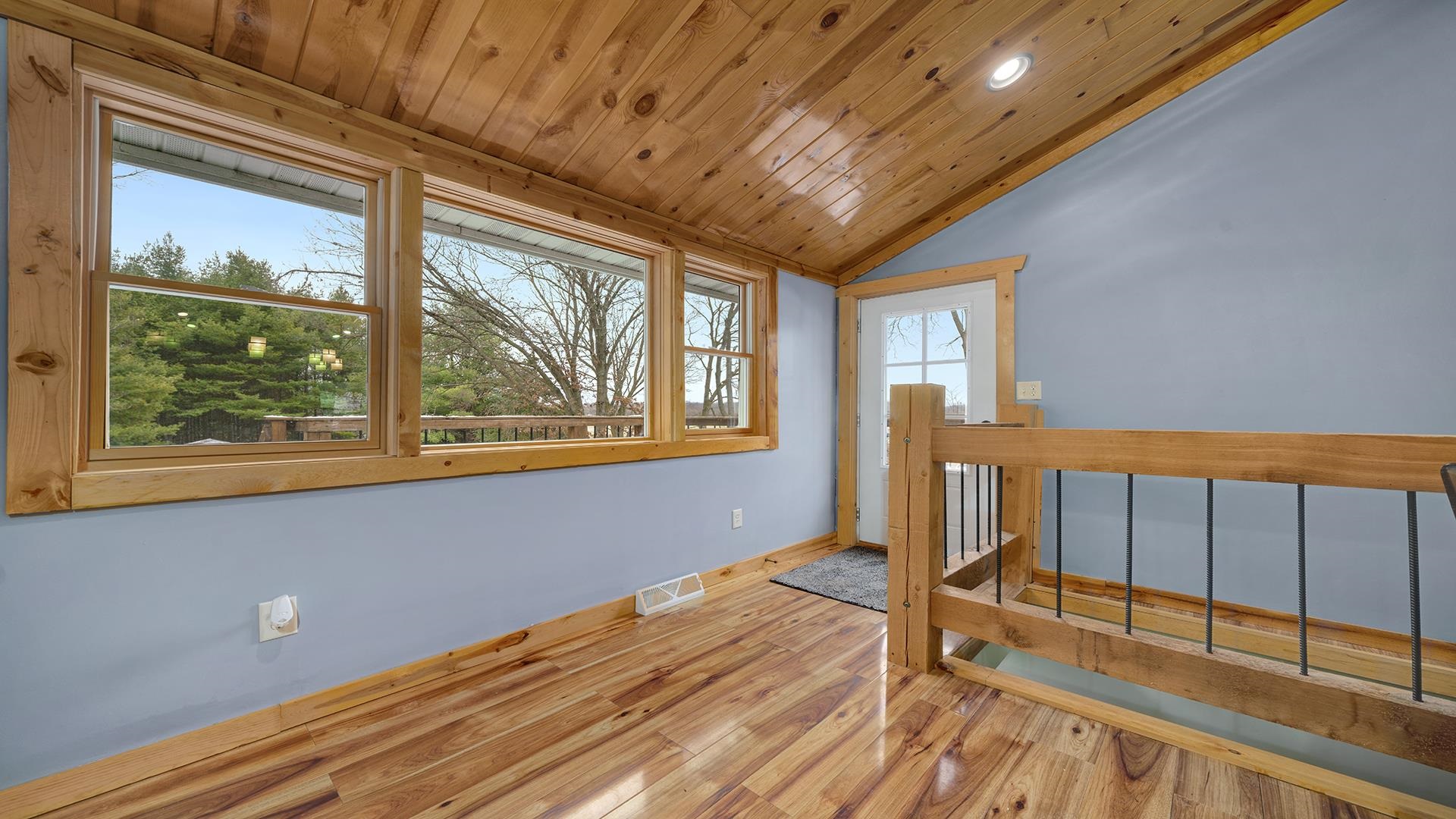 2063 Grand Detour Road Dixon, IL 61021 - Photo 5 of 44 a view of an empty room with wooden floor and a window