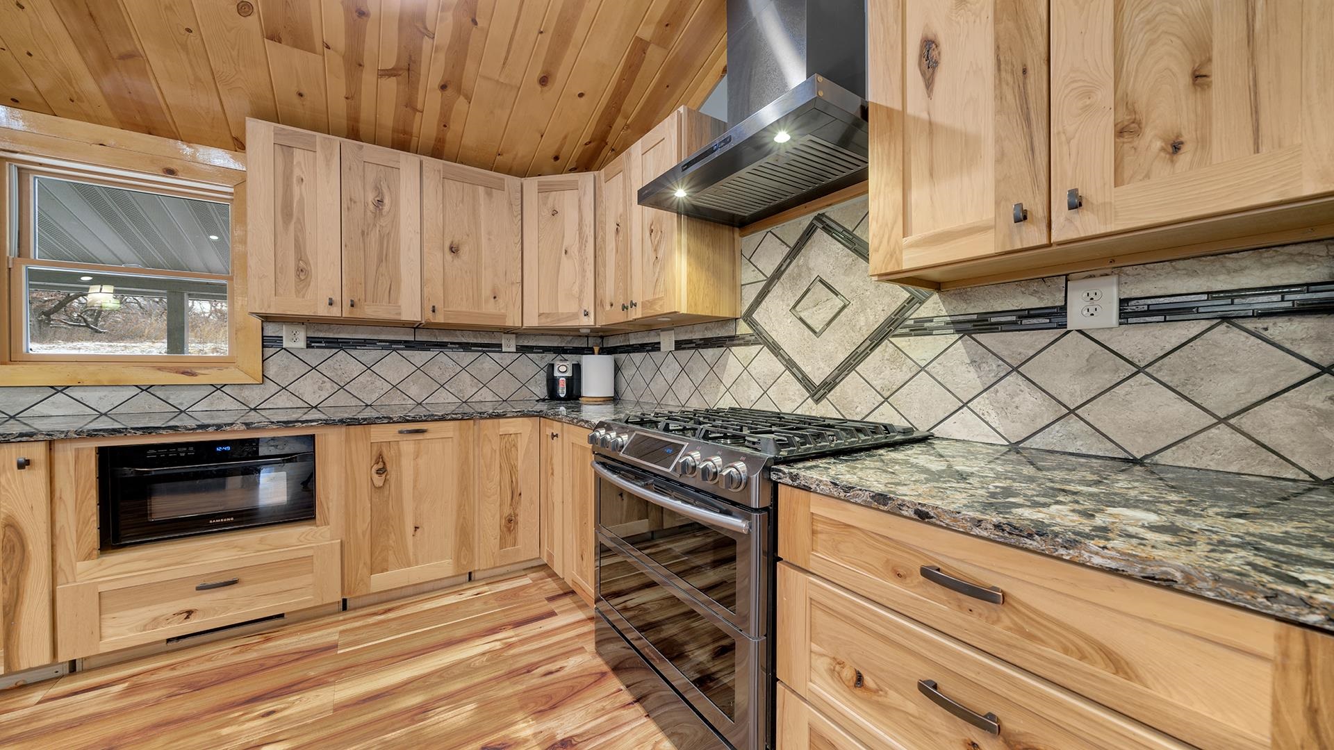 2063 Grand Detour Road Dixon, IL 61021 - Photo 10 of 44 a kitchen with granite countertop a stove and a sink