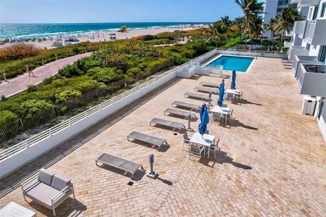 a view of a backyard with sitting area