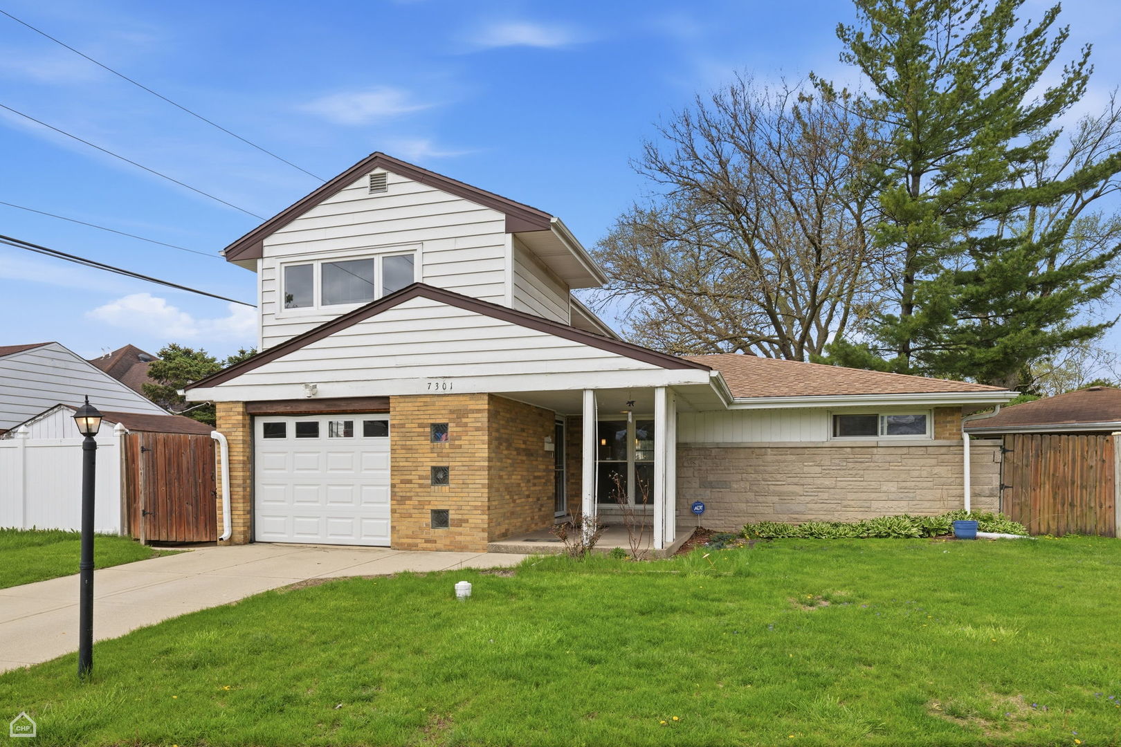 7301 Davis Street Morton Grove, IL 60053 - Photo 1 of 14 front view of a house with a yard