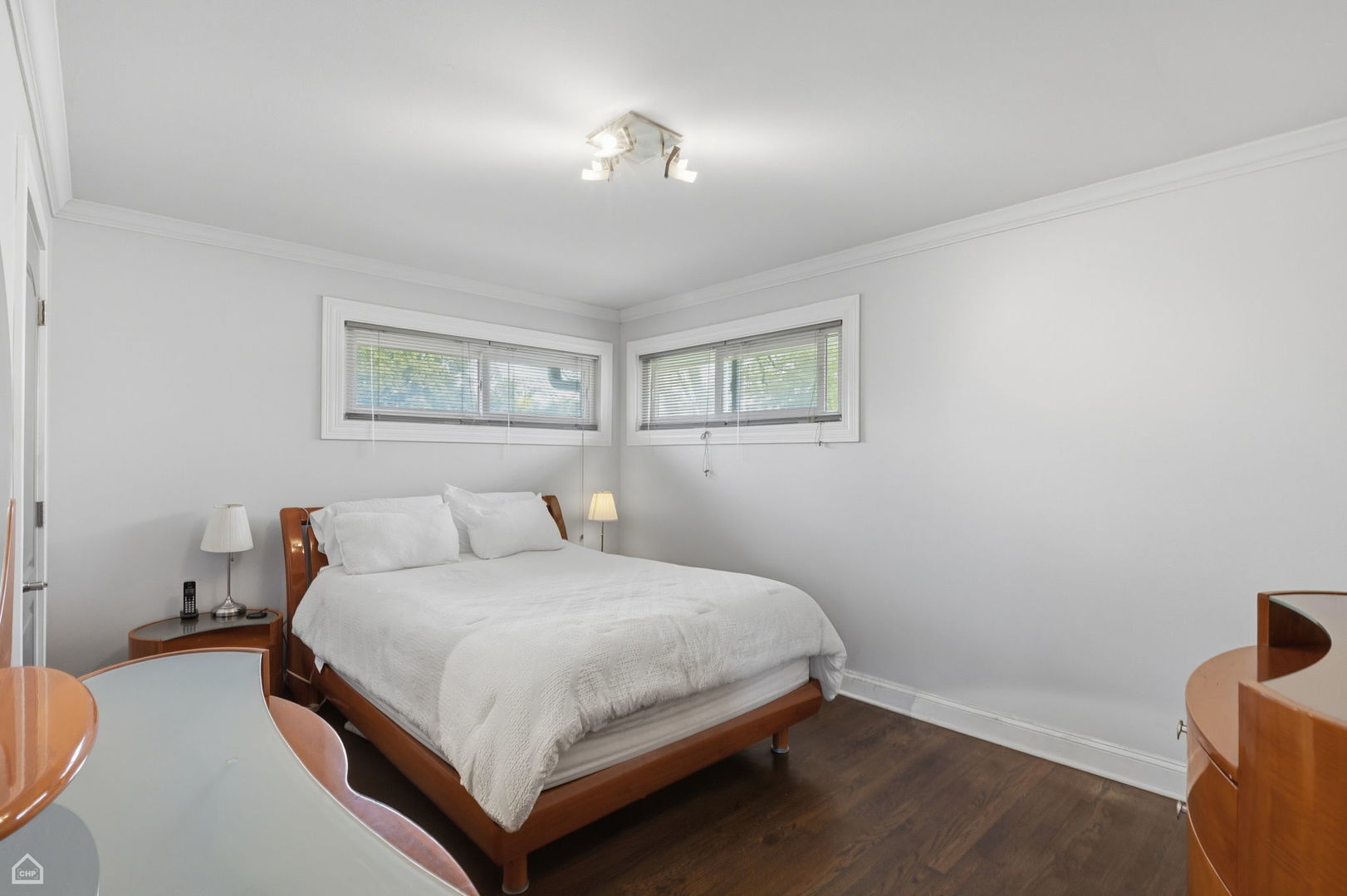 7301 Davis Street Morton Grove, IL 60053 - Photo 12 of 14 a bedroom with a bed and a window
