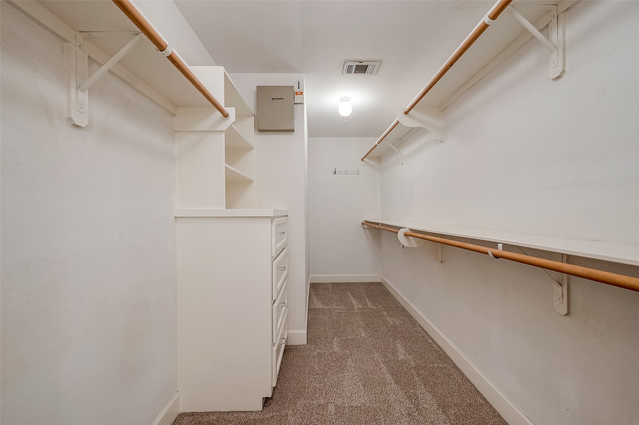 2710 Hullsmith Drive, Unit 1503 Houston, TX 77063 - Photo 14 of 14 a view of walk in closet with empty racks