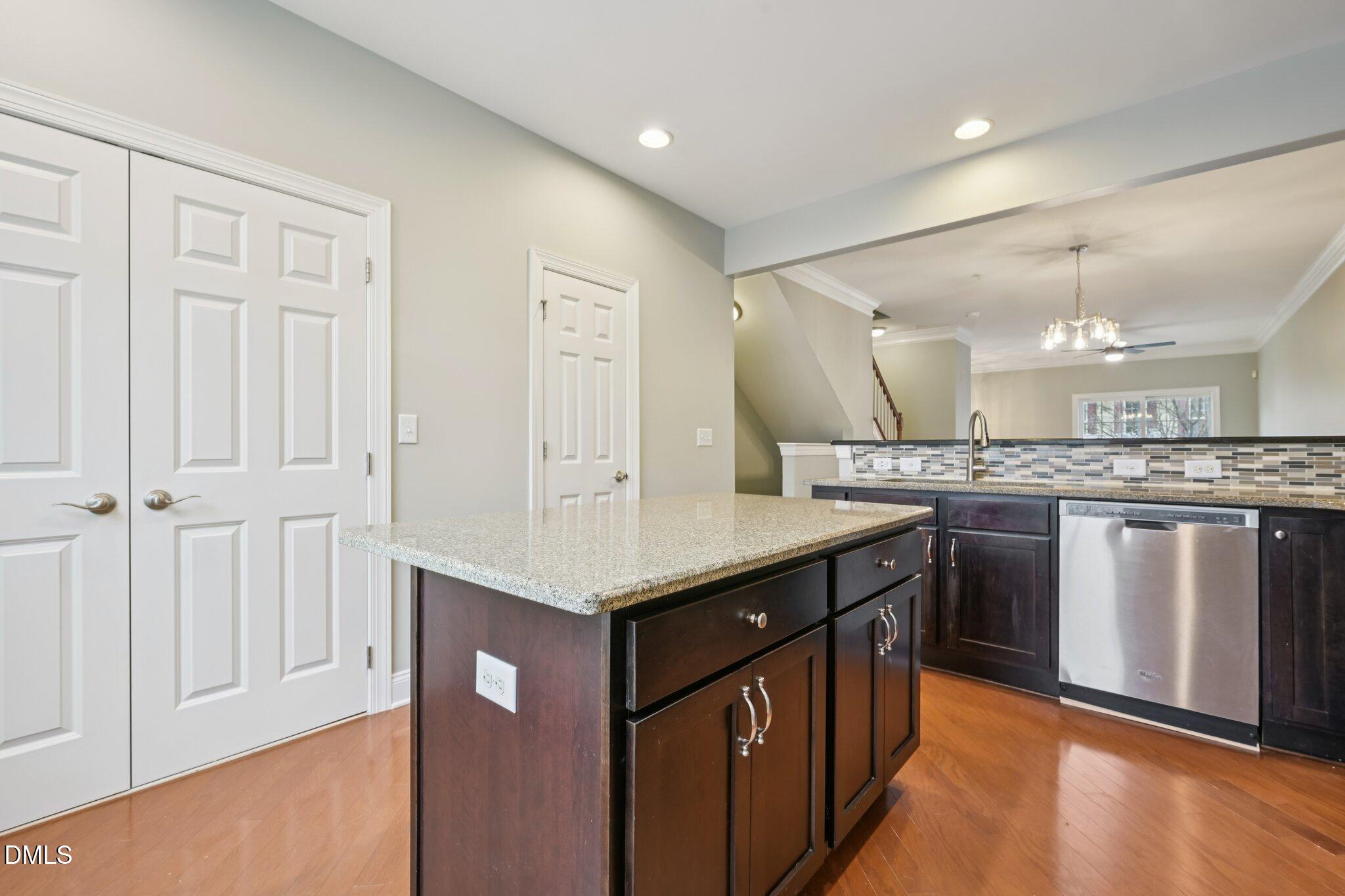 10510 Sablewood Drive, Unit 113 Raleigh, NC 27617 - Photo 17 of 38 a kitchen with stainless steel appliances granite countertop a sink a stove and a refrigerator