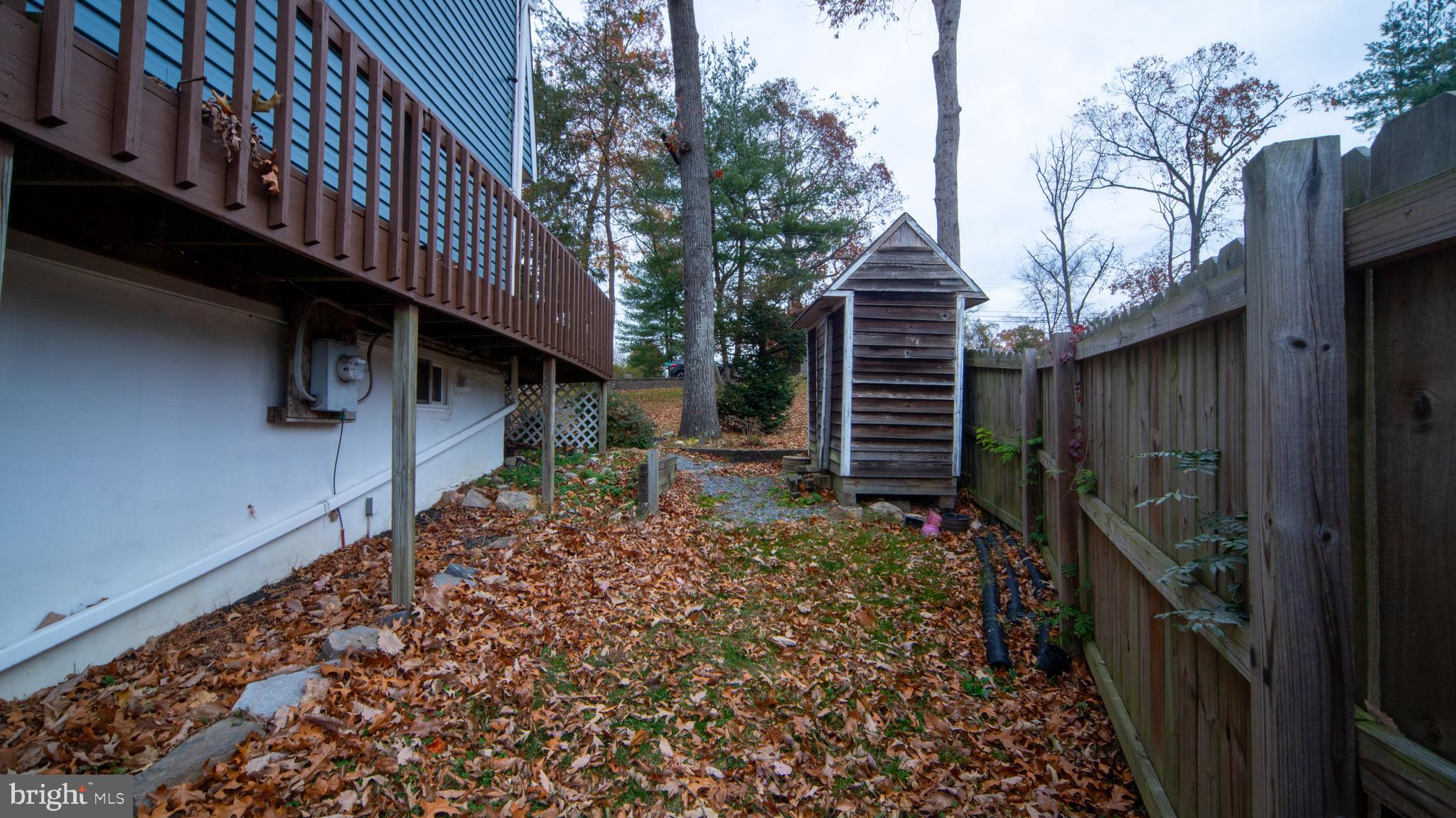 593 Riverside Drive Pasadena, MD 21122 - Photo 20 of 26 a backyard of a house with lots of green space