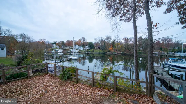 a view of a deck with furniture and a yard