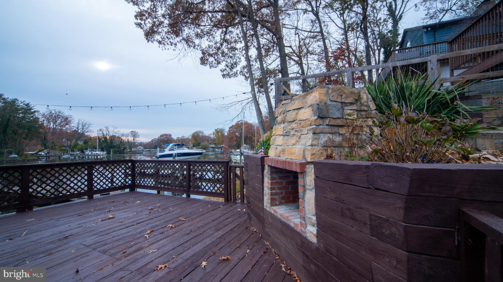 593 Riverside Drive Pasadena, MD 21122 - Photo 25 of 26 a view of a terrace with wooden floor and outdoor space