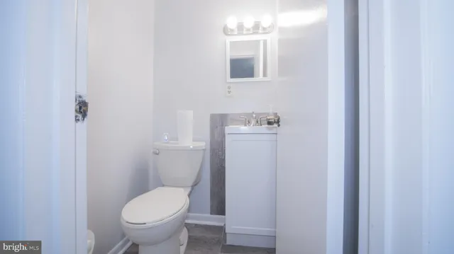 a bathroom with a toilet and a sink