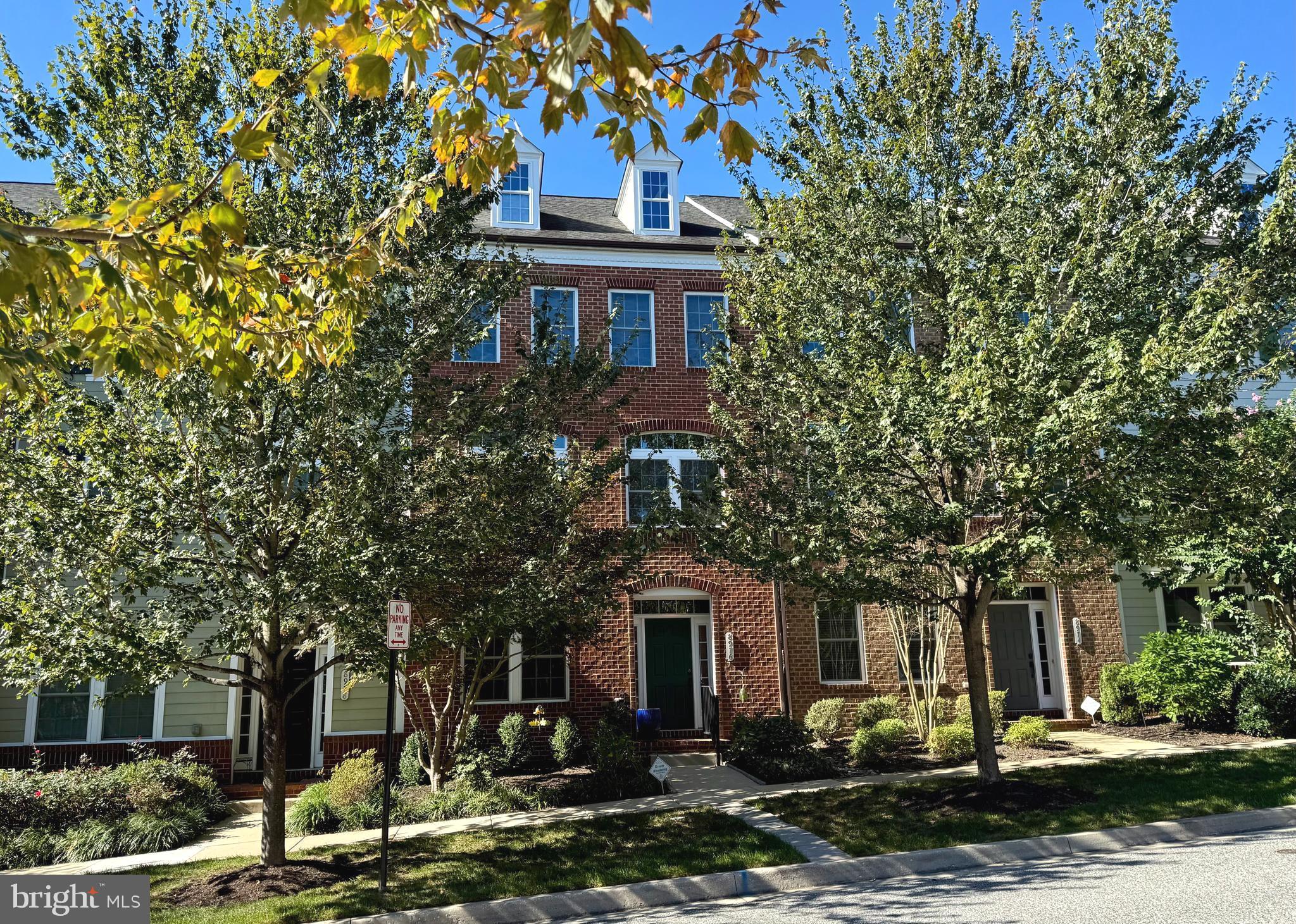 a front view of a house with street view