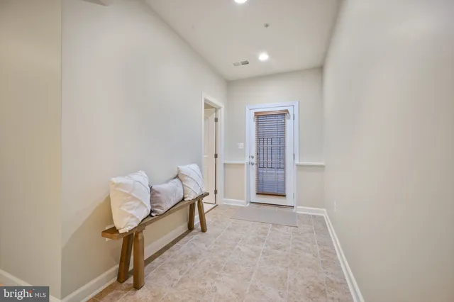 a kitchen with granite countertop a stove and a sink