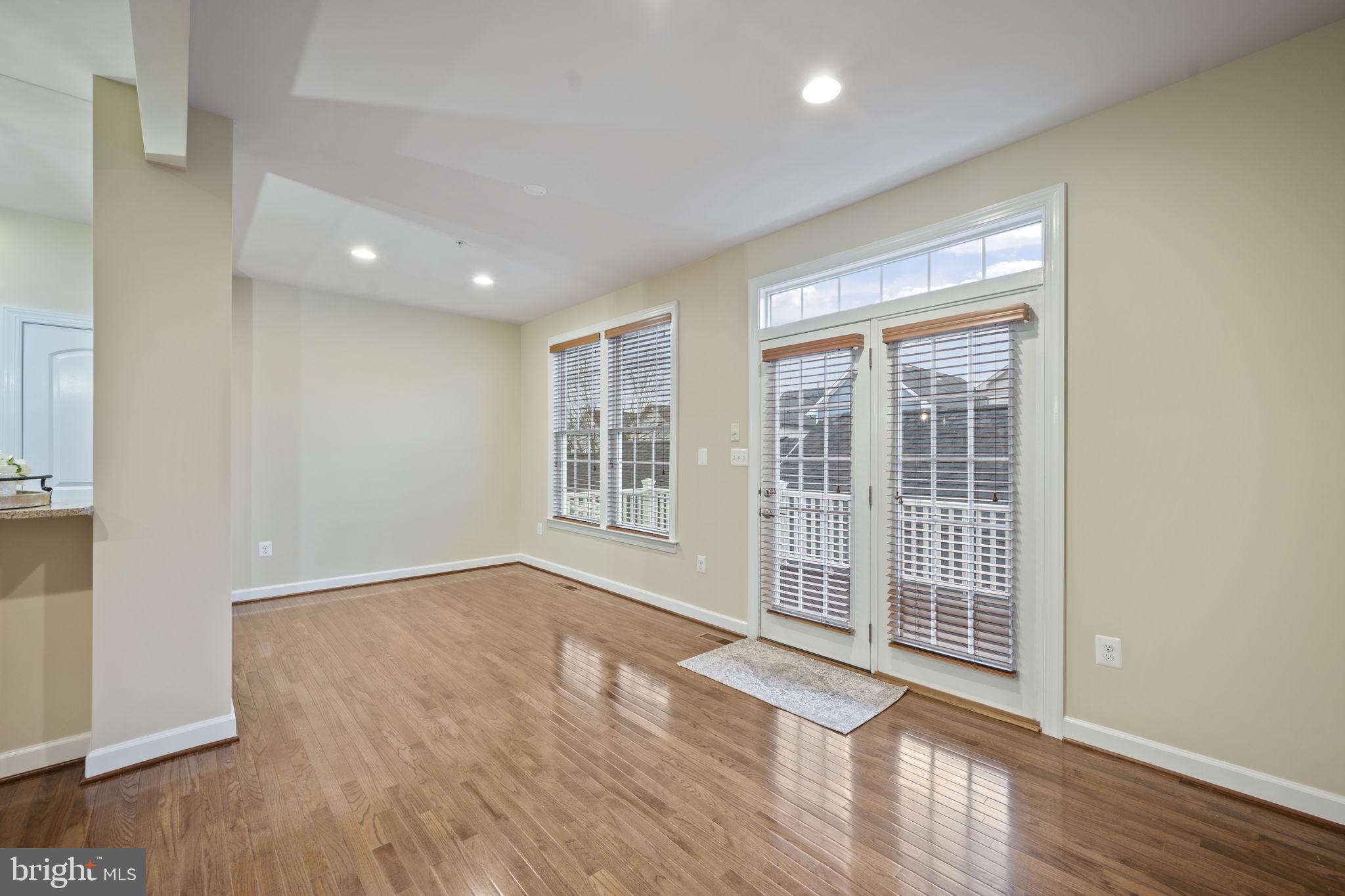 8976 Tawes Street Fulton, MD 20759 - Photo 23 of 65 an empty room with wooden floor and windows