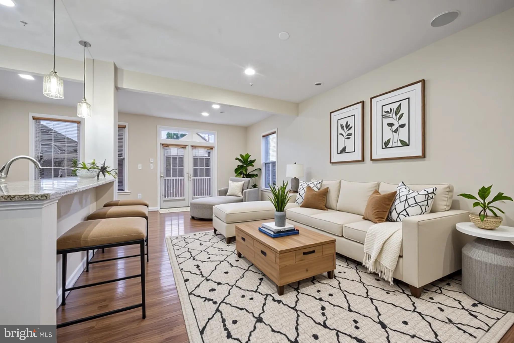 8976 Tawes Street Fulton, MD 20759 - Photo 24 of 65 a living room with furniture and wooden floor