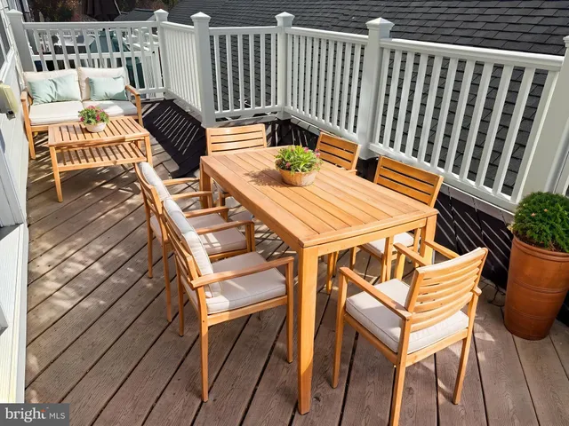 a view of a chairs and table on the deck