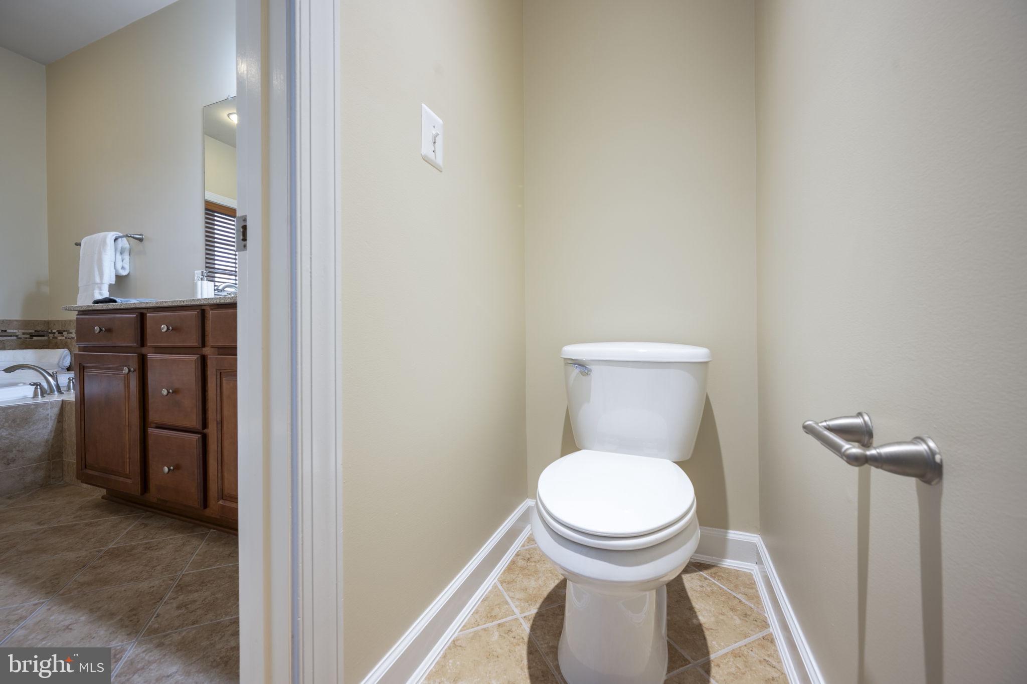8976 Tawes Street Fulton, MD 20759 - Photo 40 of 65 a bathroom with a toilet and a sink