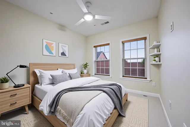 a view of a roof deck with furniture