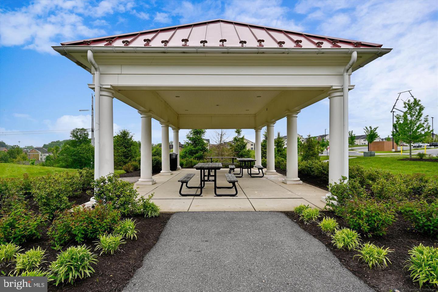8976 Tawes Street Fulton, MD 20759 - Photo 64 of 65 a view of a patio with table and chairs potted plants with wooden fence