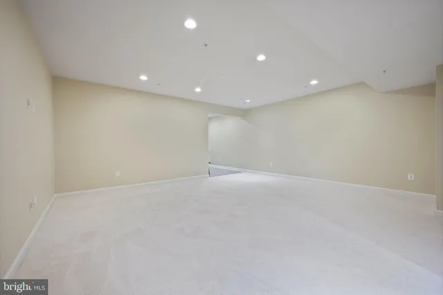 a bathroom with a granite countertop sink a toilet and a mirror
