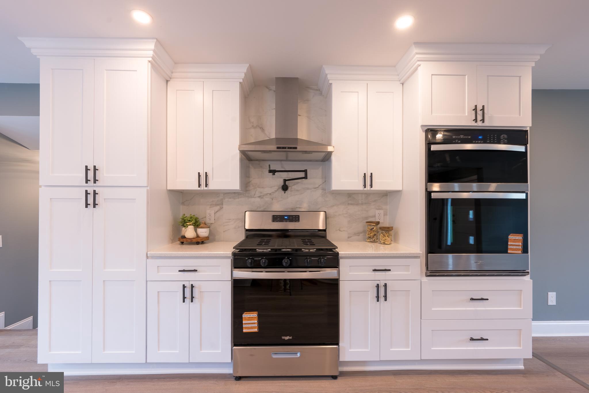 3 Slalom Court Pine Hill, NJ 08021 - Photo 9 of 47 a kitchen with stainless steel appliances white cabinets and a stove