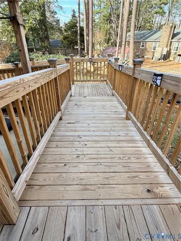a view of deck with wooden floor and seating space