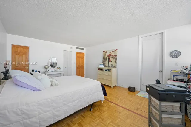 a bedroom with a bed and a table in it