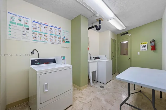 a view of a storage and utility room with a washer and dryer