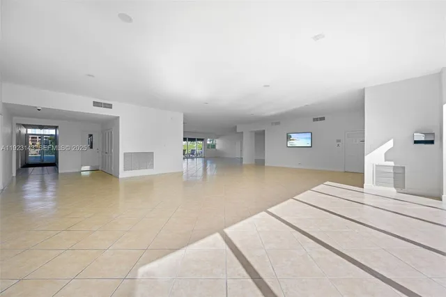 a bedroom with a bed and a view of outdoor space