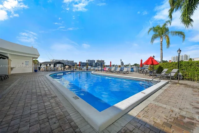 a view of a swimming pool with a lounge chairs