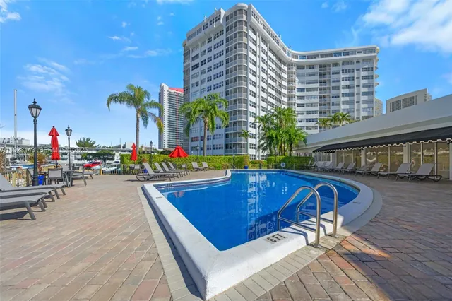a view of a swimming pool with sitting area