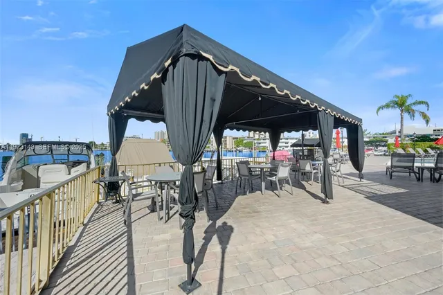 a view of a swimming pool with outdoor seating