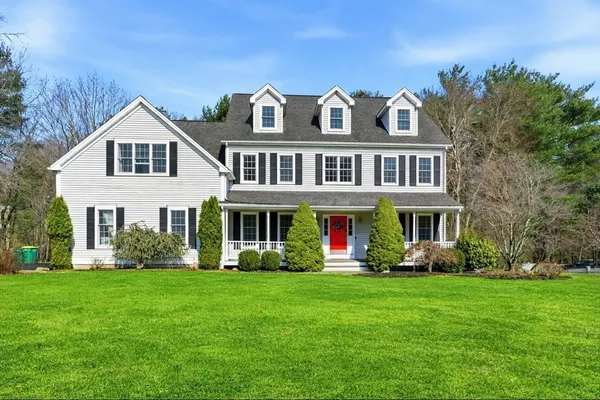 a front view of house with yard and green space