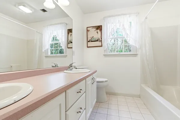 a bathroom with a sink a bathtub and a shower