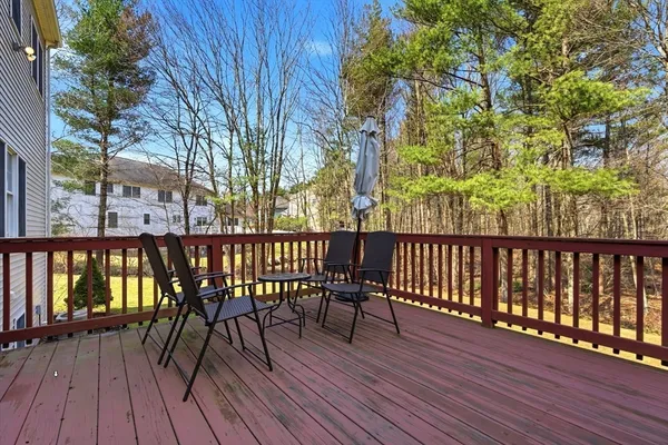 a view of balcony with wooden floor and outdoor seating
