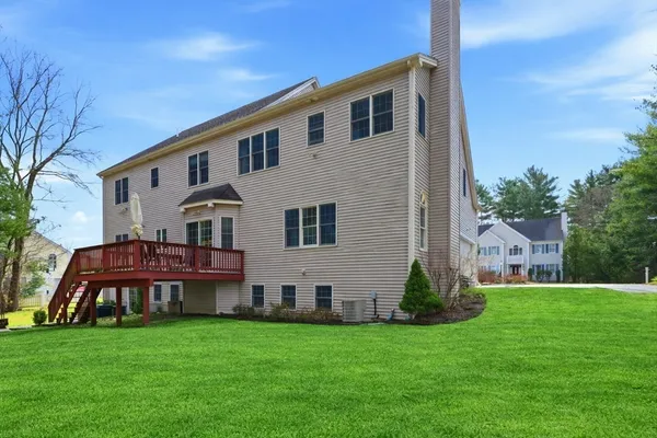 a view of house with backyard