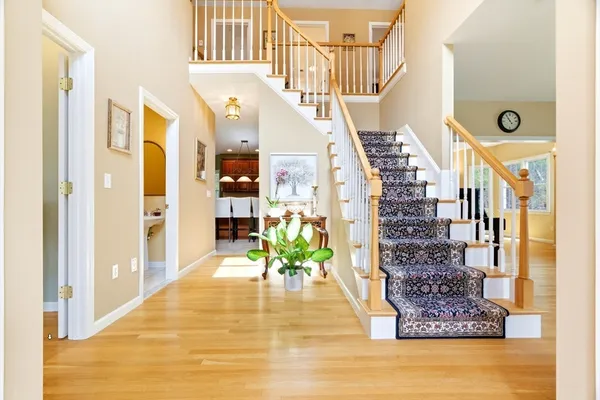 a view of entryway and hall with wooden floor