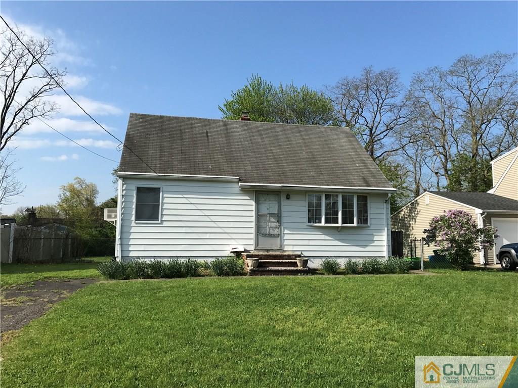147 Tunison Road New Brunswick, NJ 08901 - Photo 1 of 1 a front view of house with yard and green space