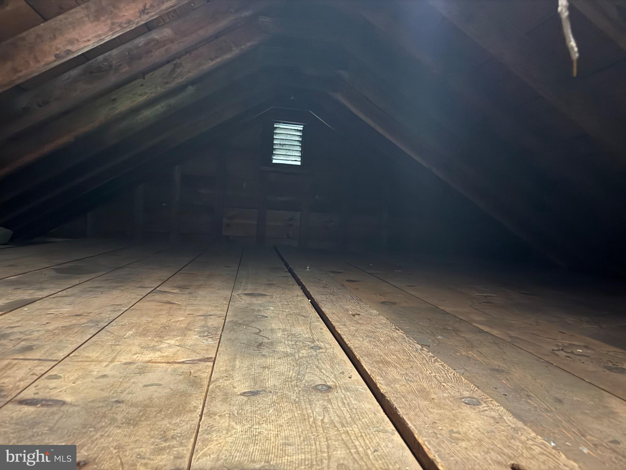 835 Martin Road Baltimore, MD 21221 - Photo 21 of 27 Spacious attic with rustic charm.